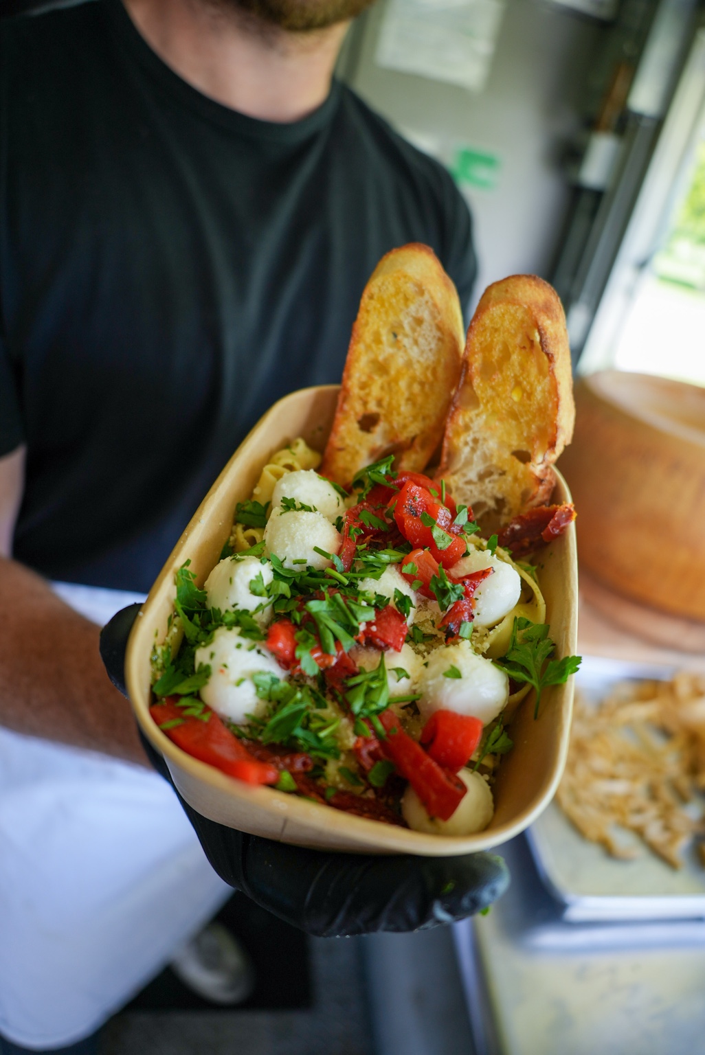 Fresh pesto pasta with colorful vegetables
