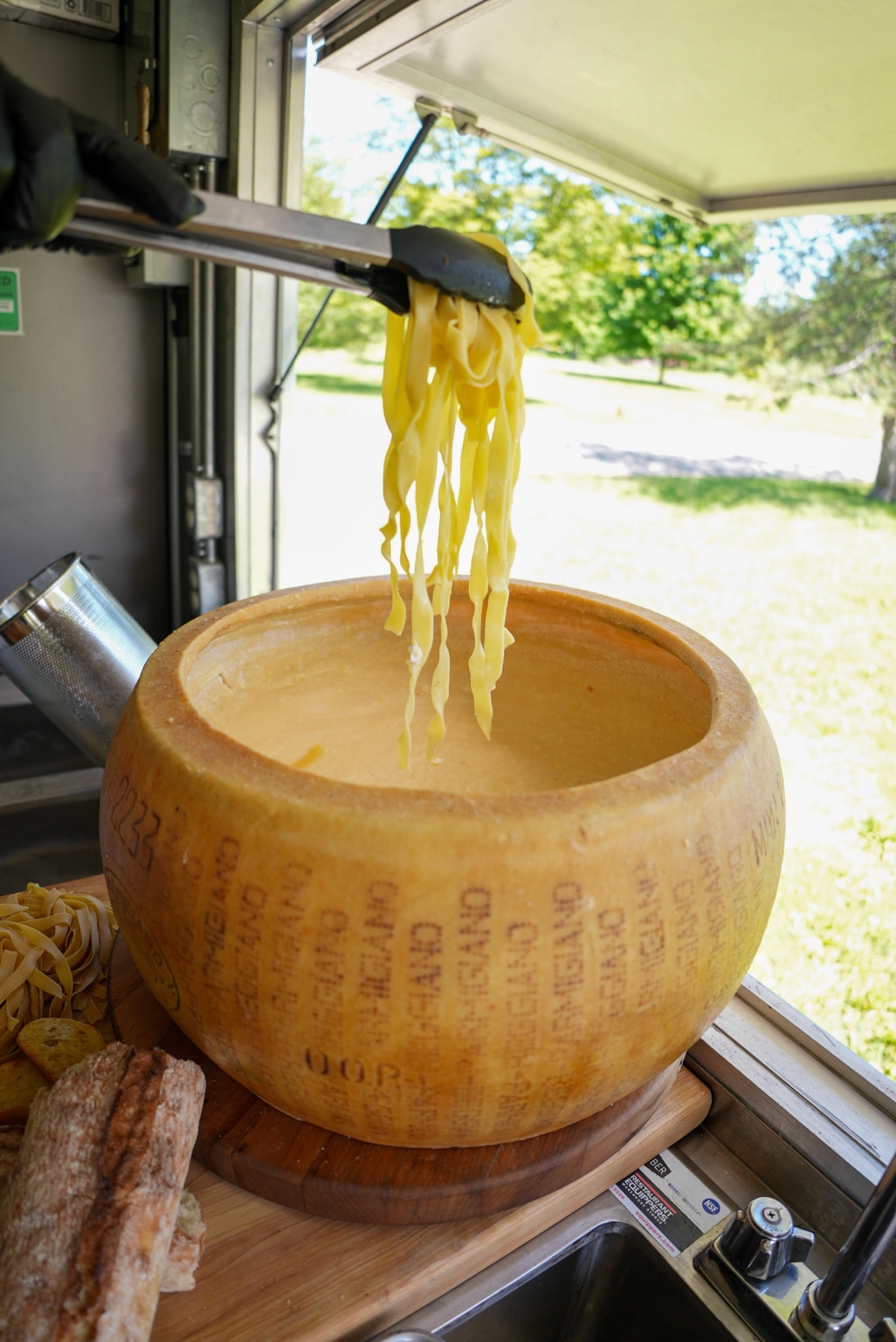 Pasta lifted from the Parmigiano wheel